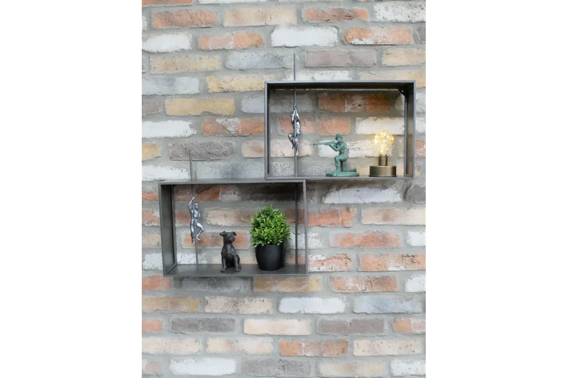 Metal wall shelves with ornaments, plant pot and decorative light on exposed brick wall