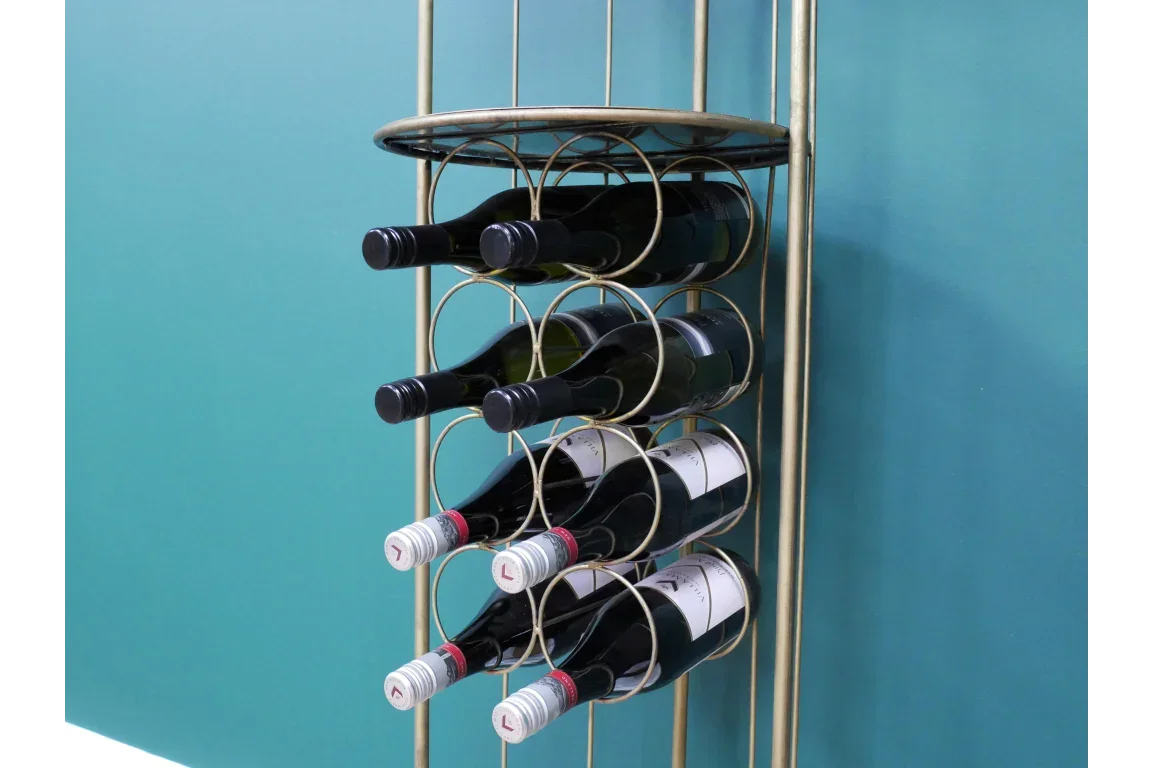 Gold metal wine rack holding nine bottles against teal wall