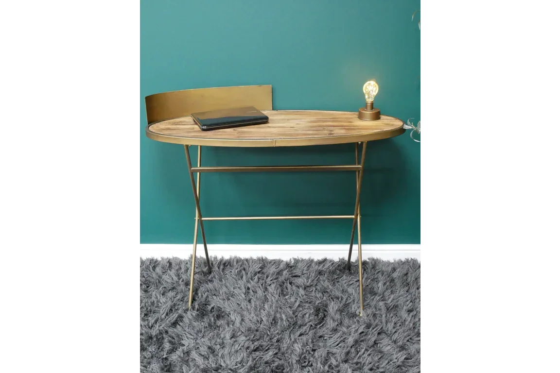 Gold metal console table with oval wooden top and sculpted back, styled on grey rug