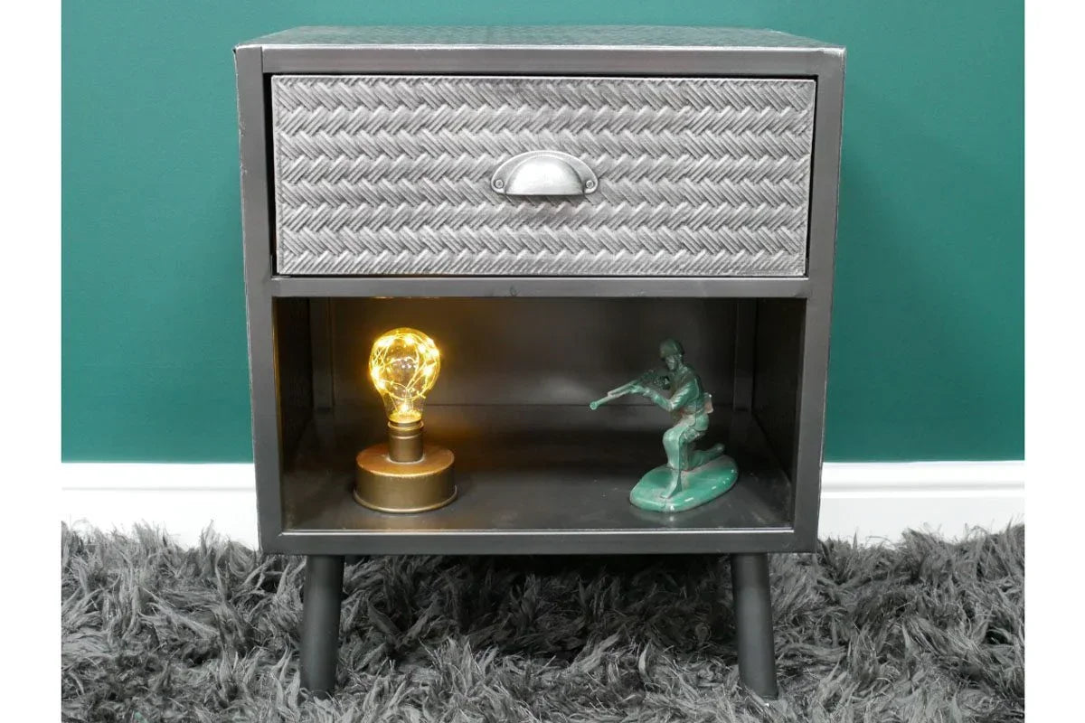 metal bedside table with textured drawer, open shelf, lamp and toy soldier on grey rug