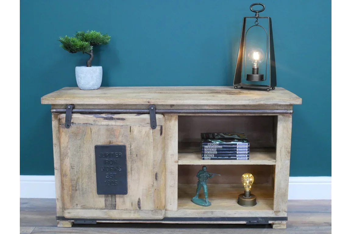 Rustic wooden sideboard with sliding door, open shelves, and decorative accents