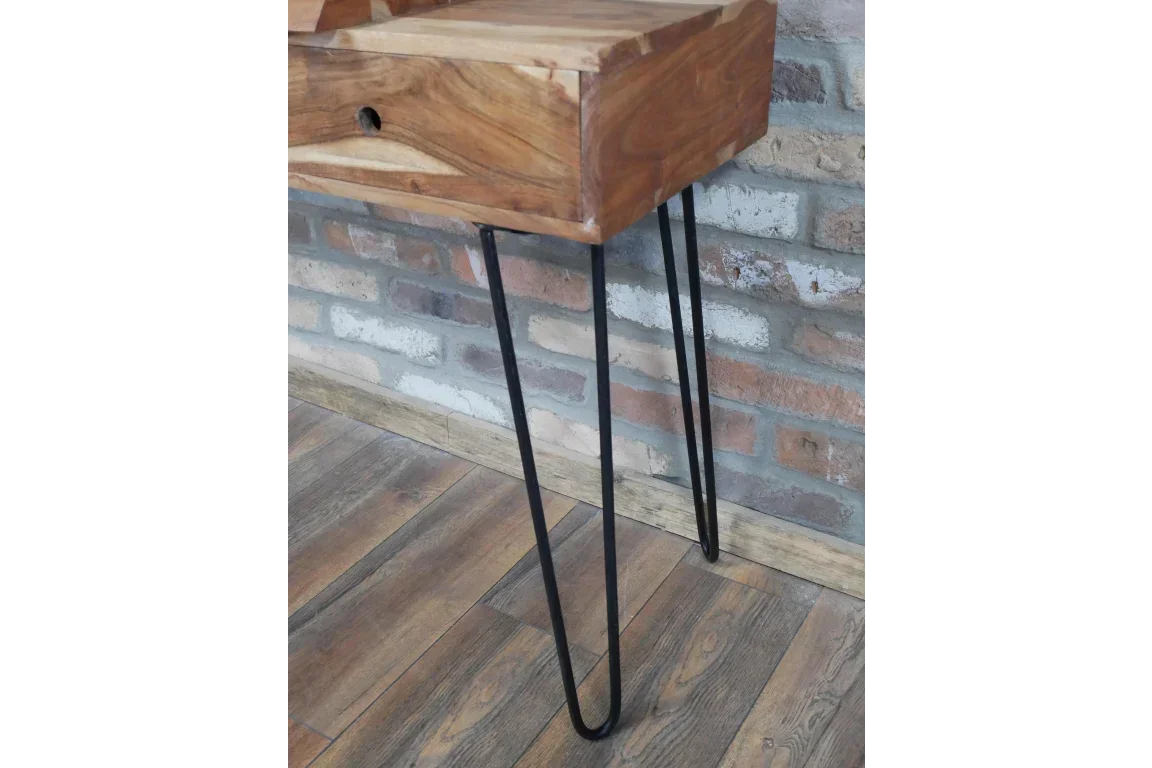 Wooden console table with black metal hairpin legs against exposed brick wall