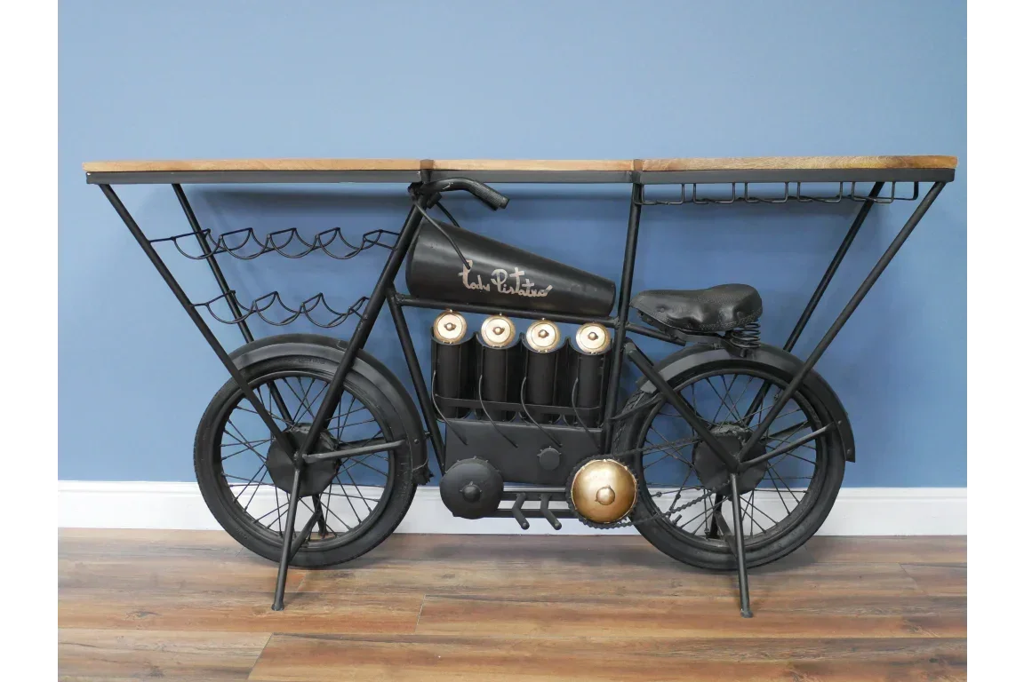 Industrial motorbike bar table with metal wine rack and wood top against blue wall