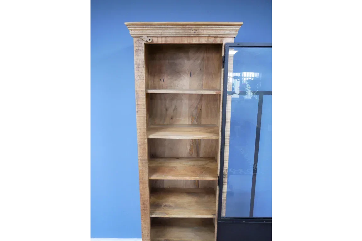 Tall wooden cabinet with glass door and five shelves against blue wall