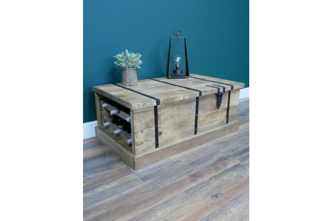 Rustic wooden coffee table with metal trim and built-in wine rack in modern living room