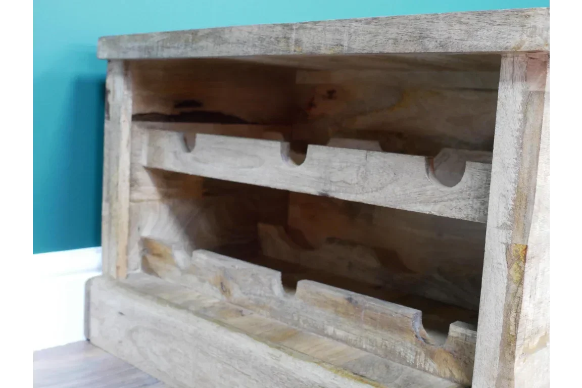 Solid wood wine rack shelf with grooves for bottle storage against teal wall