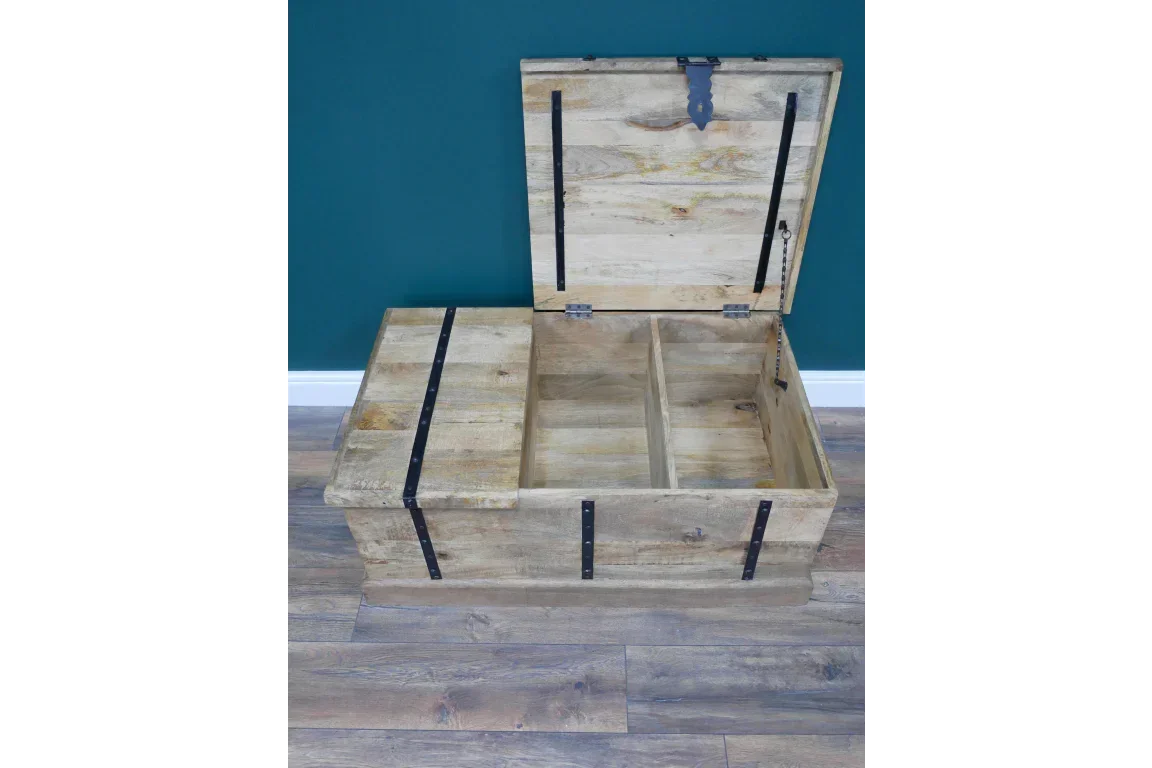 Rustic wooden storage trunk with black metal straps and open lid, divided compartments inside