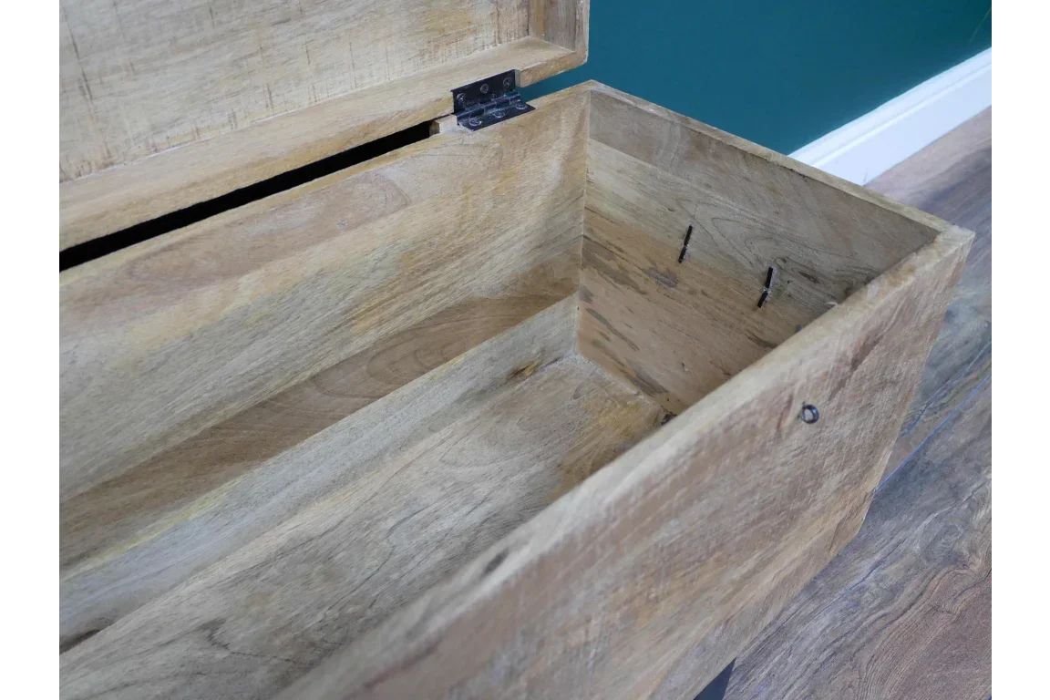 Open wooden storage chest showing interior detail and natural wood grain finish