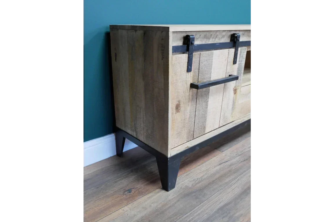 Rustic wood sideboard with black metal sliding door and legs on laminate floor