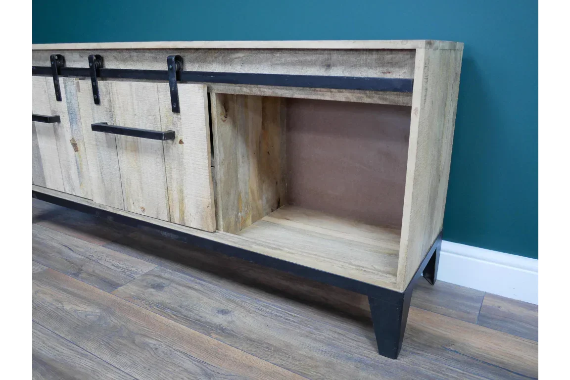 Wooden sideboard with sliding barn doors and black metal legs on hardwood floor