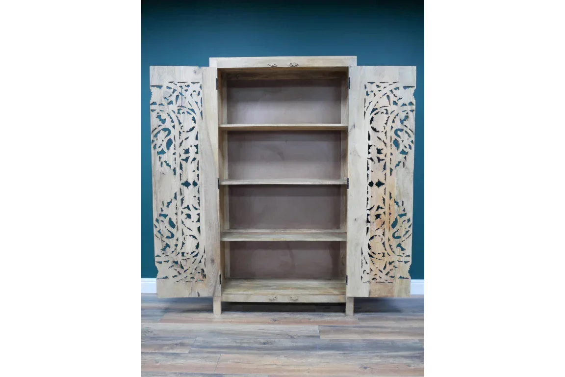 Natural wood cabinet with carved doors and three open interior shelves, full front view