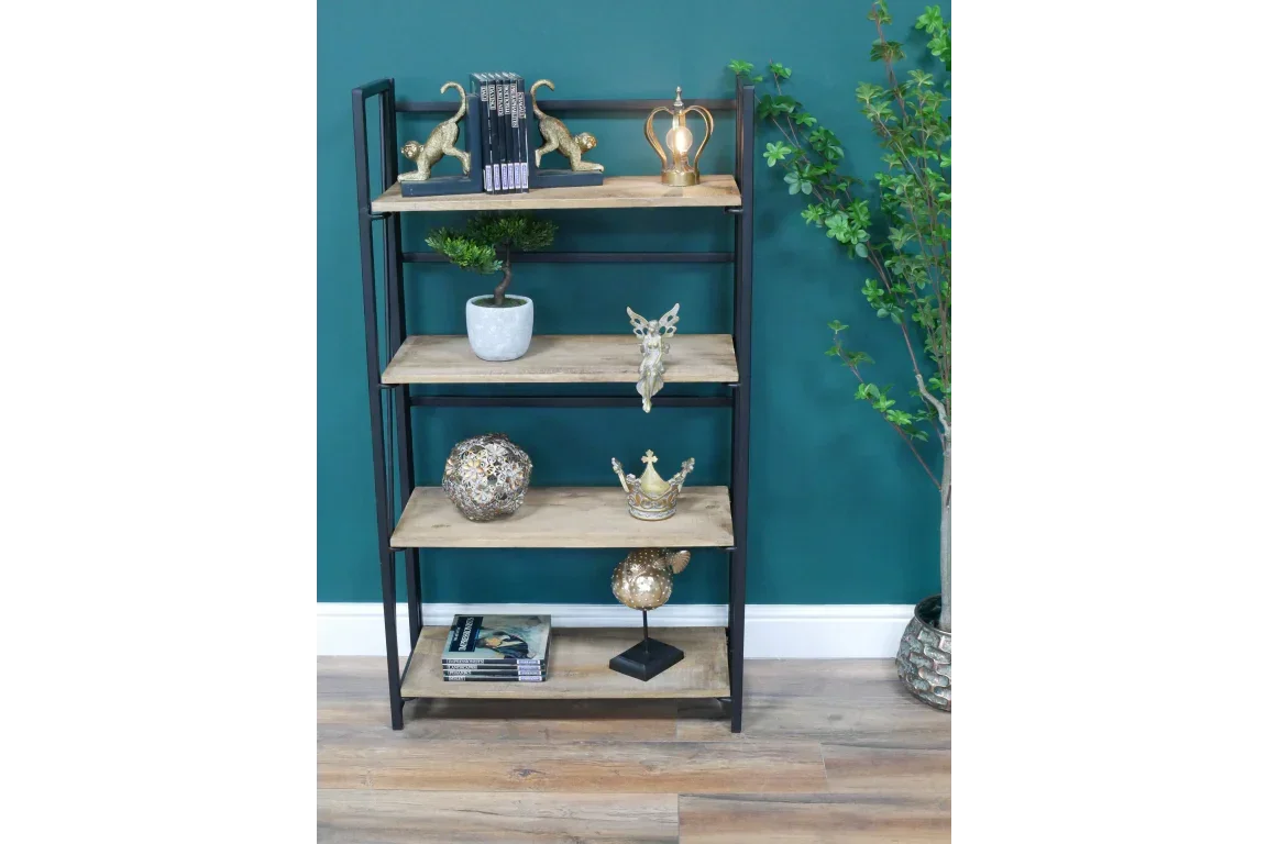 Industrial wood and metal shelving unit with decor against teal wall and wooden floor