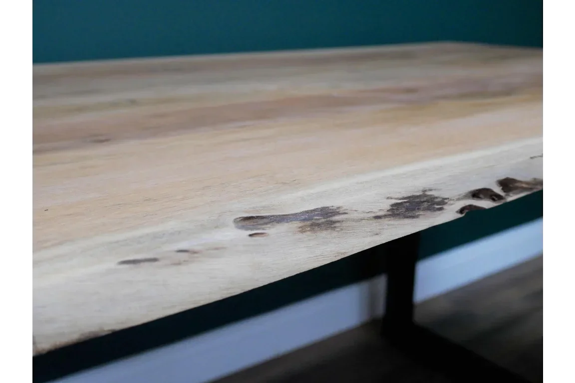 Live edge solid wood dining table top with natural grain and black metal legs