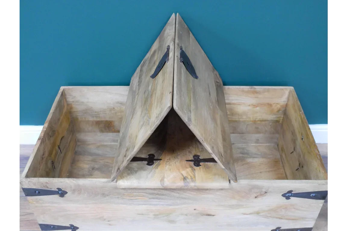 Mango wood storage chest with split lift-up lid and black metal hinges, interior view