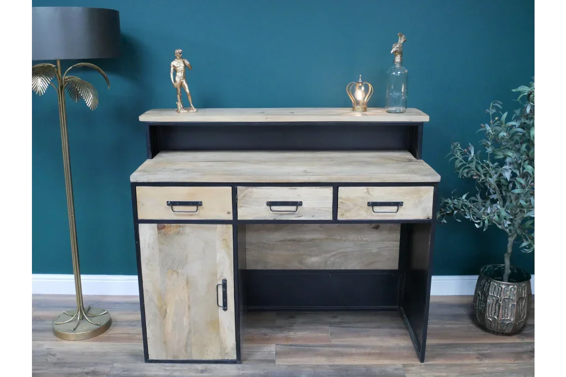 Industrial wood desk with black metal frame, three drawers and a left cabinet, styled in room