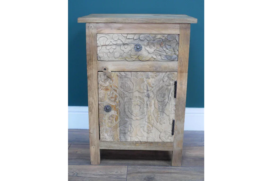 Wooden bedside cabinet with carved floral detail, single drawer and door, rustic finish
