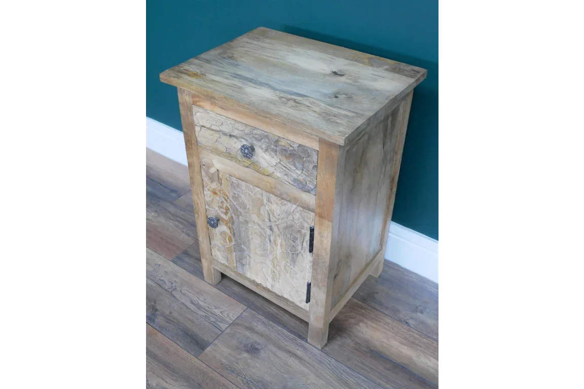 Rustic wooden bedside cabinet with textured drawer and door on wooden floor