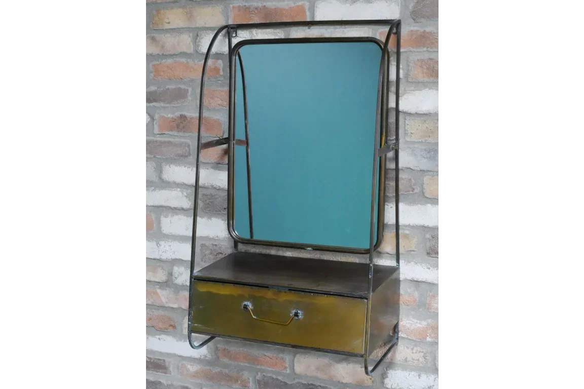 Industrial wall mirror with metal frame and storage drawer mounted on brick wall