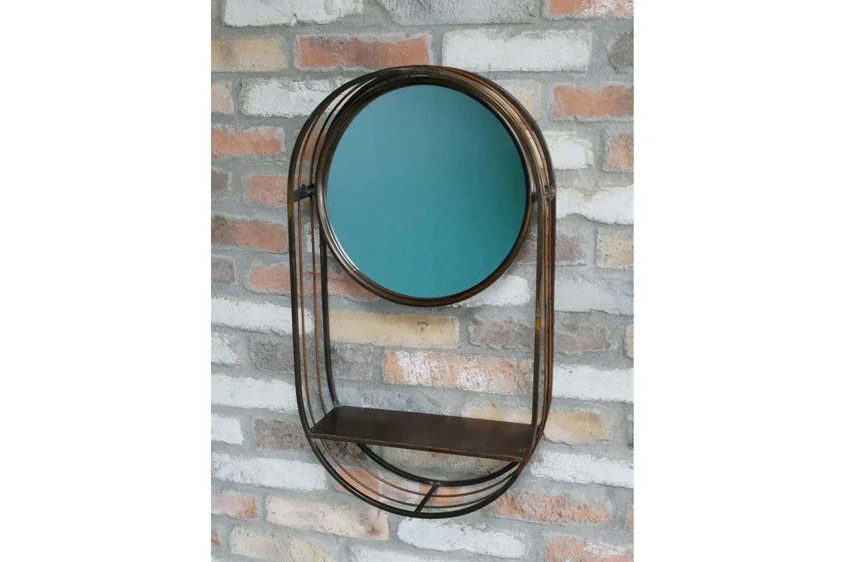 Round wall mirror with metal frame and integrated shelf on exposed brick wall
