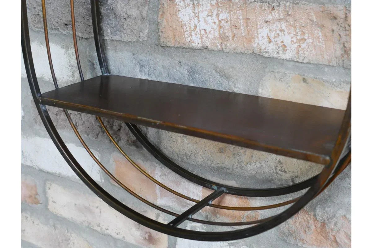 Round metal wall shelf with dark wood surface mounted on exposed brick wall