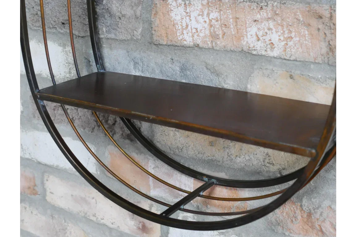 Industrial wall shelf with circular metal frame and wooden shelf against brick wall