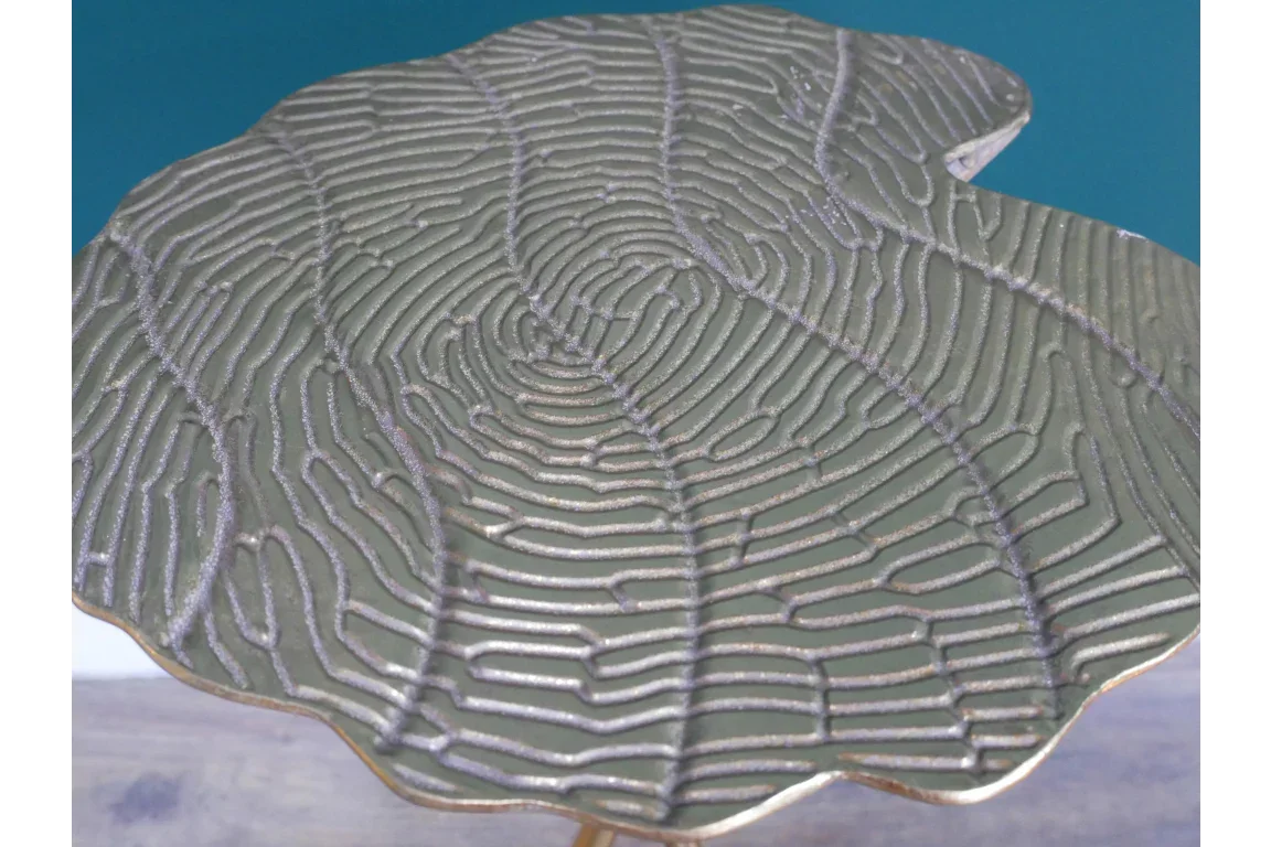 Textured metal side table top with leaf vein pattern in silver finish