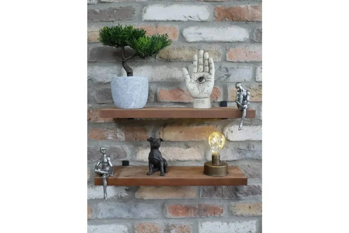 Floating wooden shelves with ornaments, potted bonsai, figurines, and decorative lamp