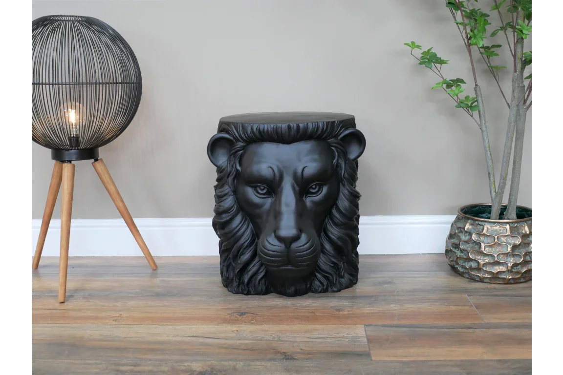 Black lion head stool in living room with wooden floor and modern decor