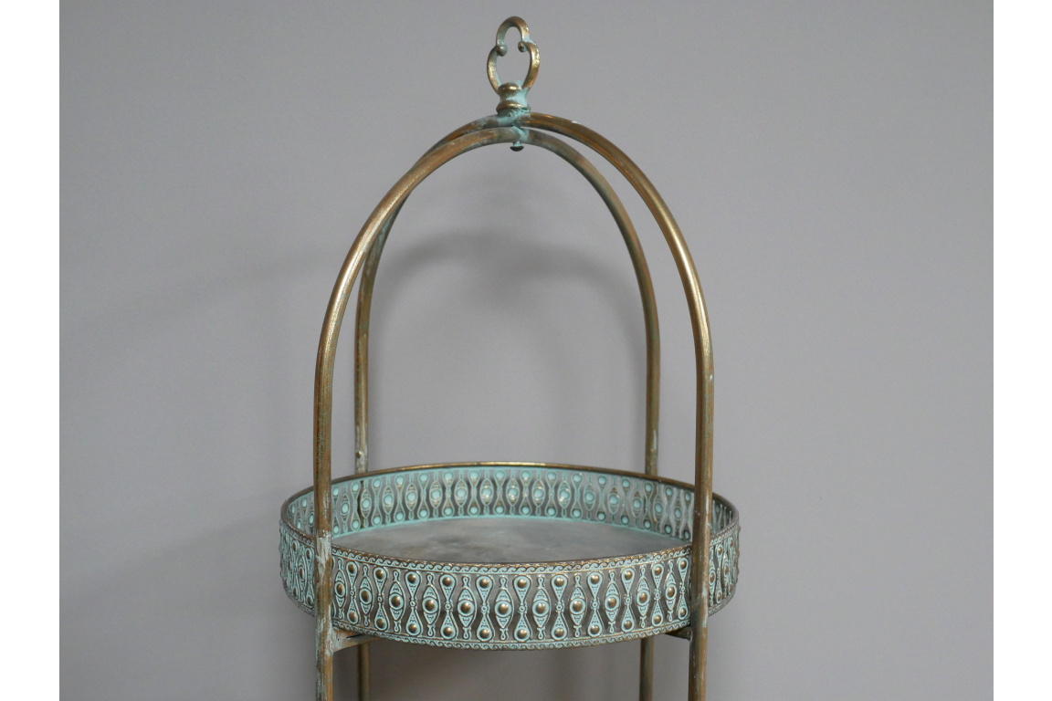 Metal Moroccan style shelves with turquoise decorative sides and arched frame, shown at front angle on plain background.