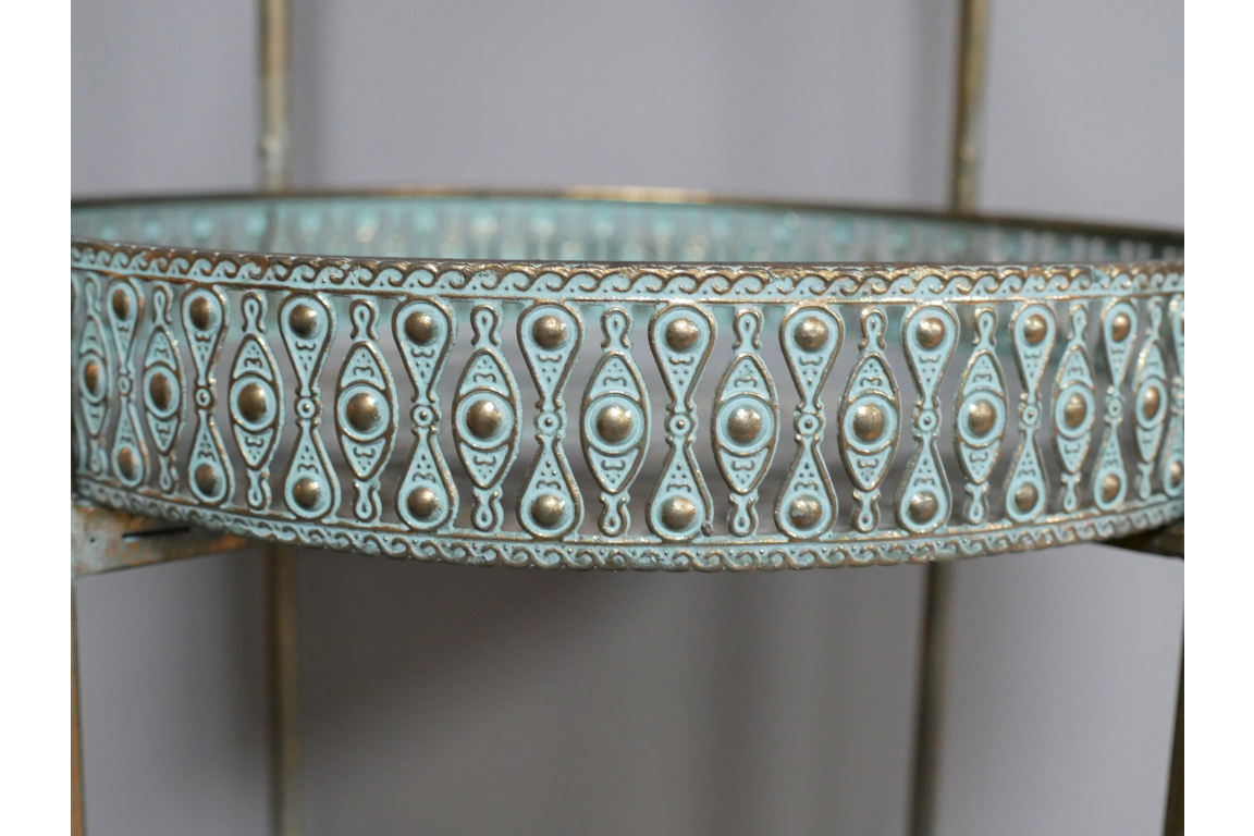 Close-up of blue and gold patterned metal edge on Moroccan style five-tier round shelf unit