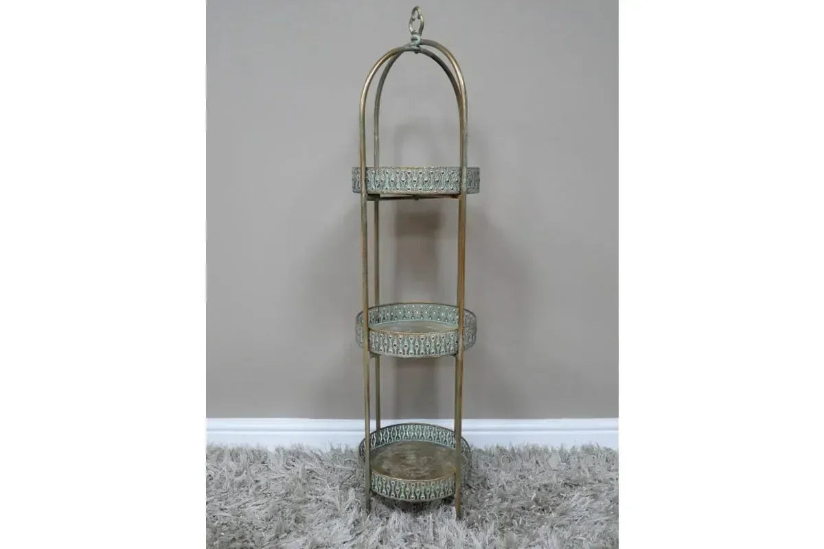 Tall metal three tier shelving unit with ornate round trays and gold finish