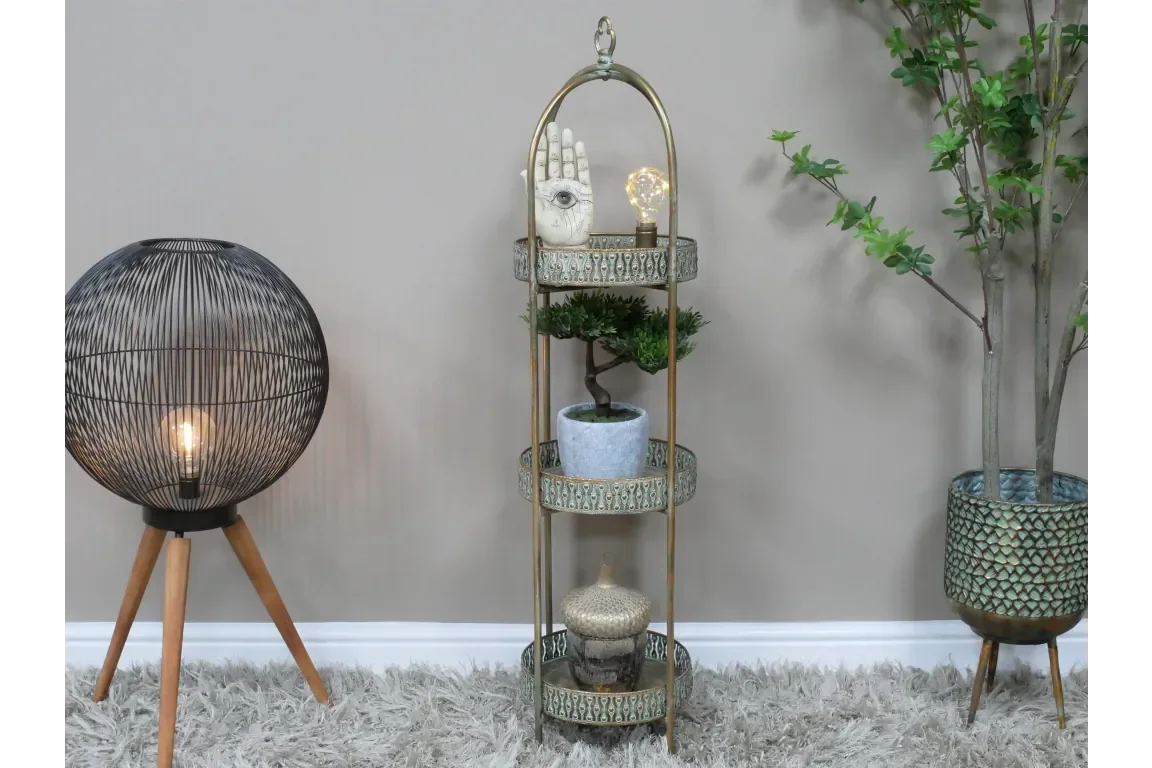 Metal floor standing shelf with decorative items and plants for living room display