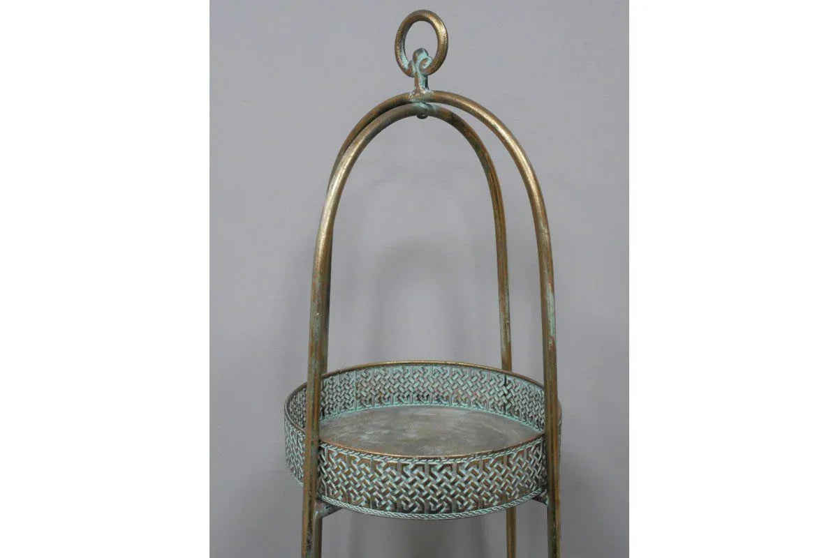 Antique brass plant stand with round top and decorative lattice detailing