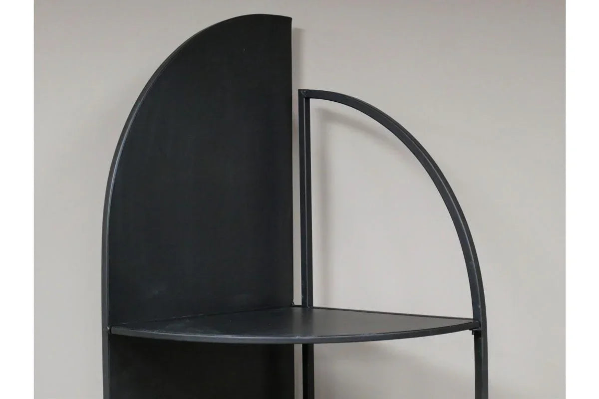 Black metal corner shelf with curved frame against neutral wall