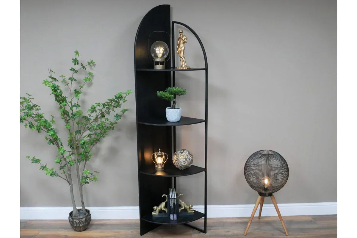 Black corner shelving unit with decorative items and potted plant in modern room