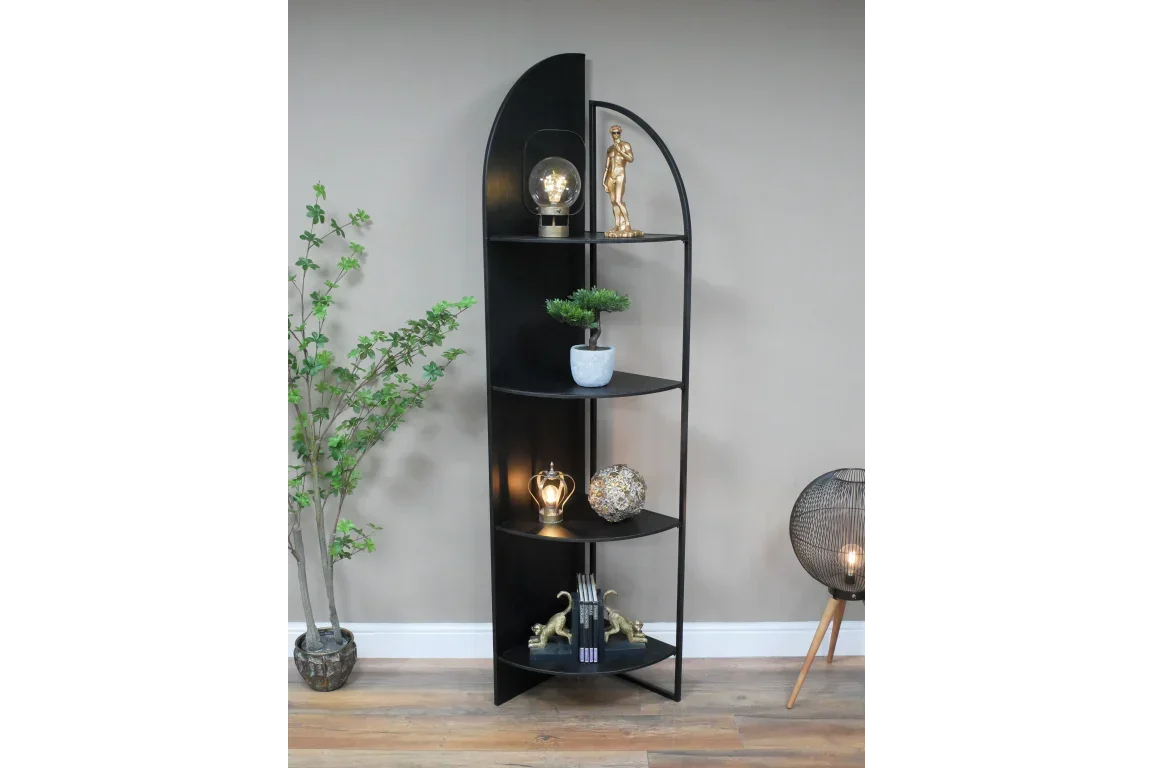 Black corner shelving unit with four shelves, metal frame and decorative items
