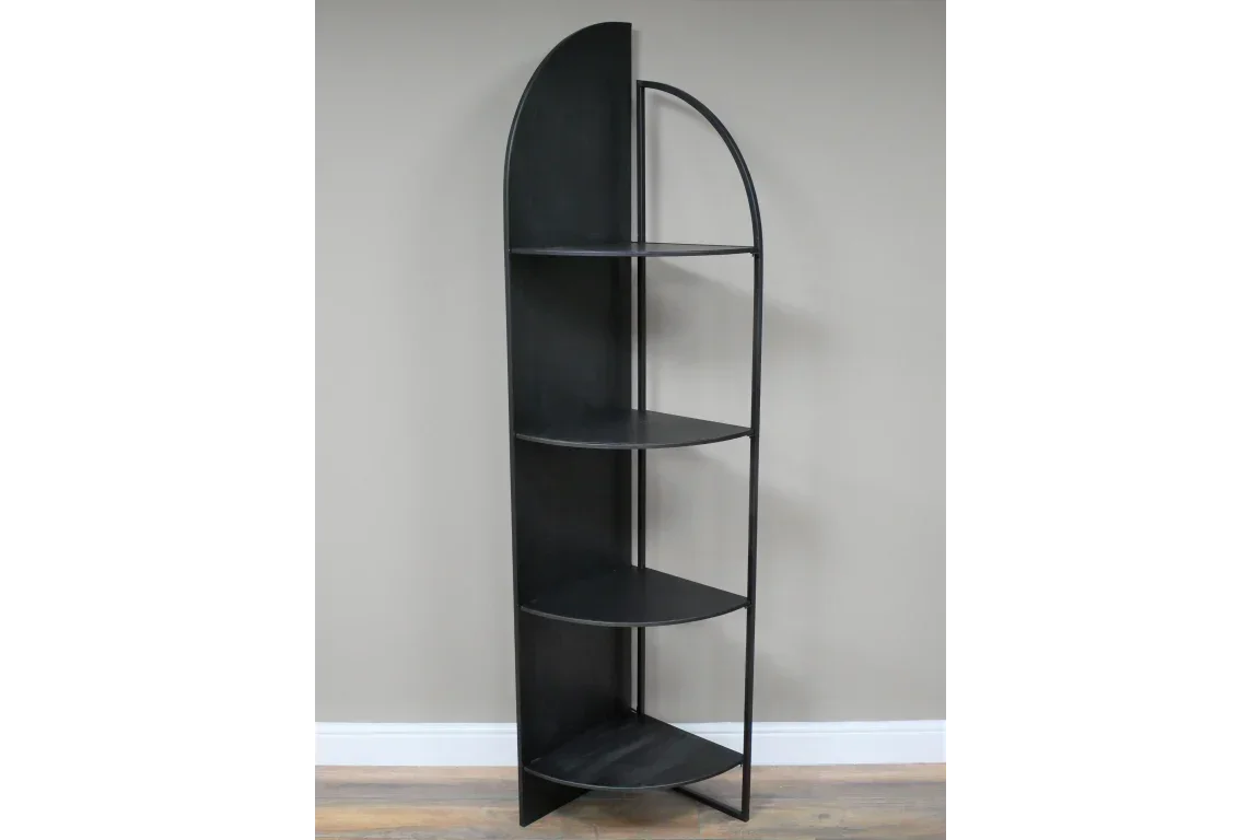 Black metal corner shelving unit with four semi-circular shelves against a grey wall