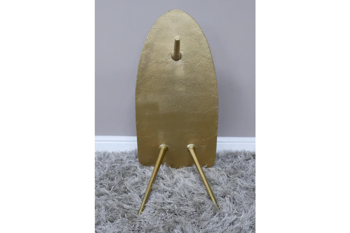 Gold finish furniture leg set with three angled wooden legs on grey carpet
