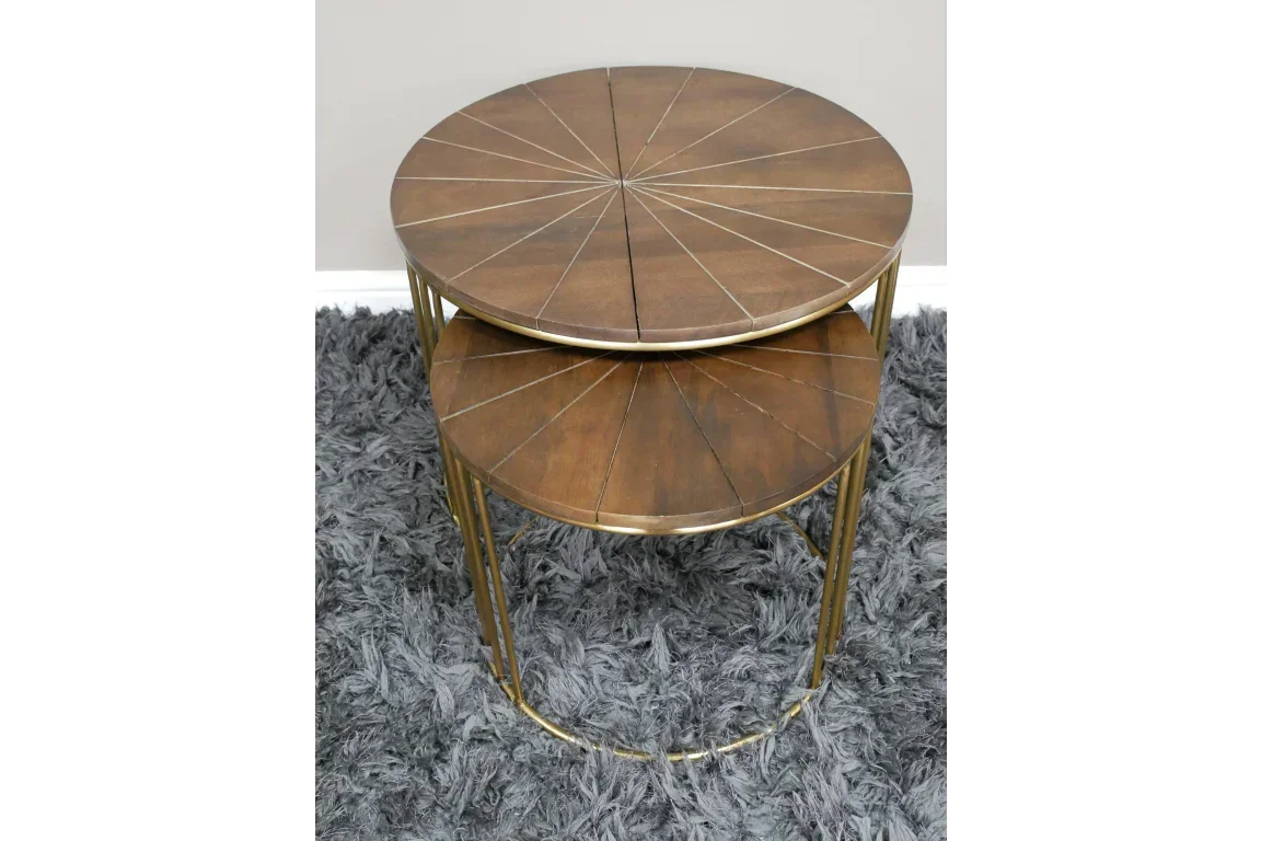 Round wood nest of tables with brass legs on grey shaggy rug