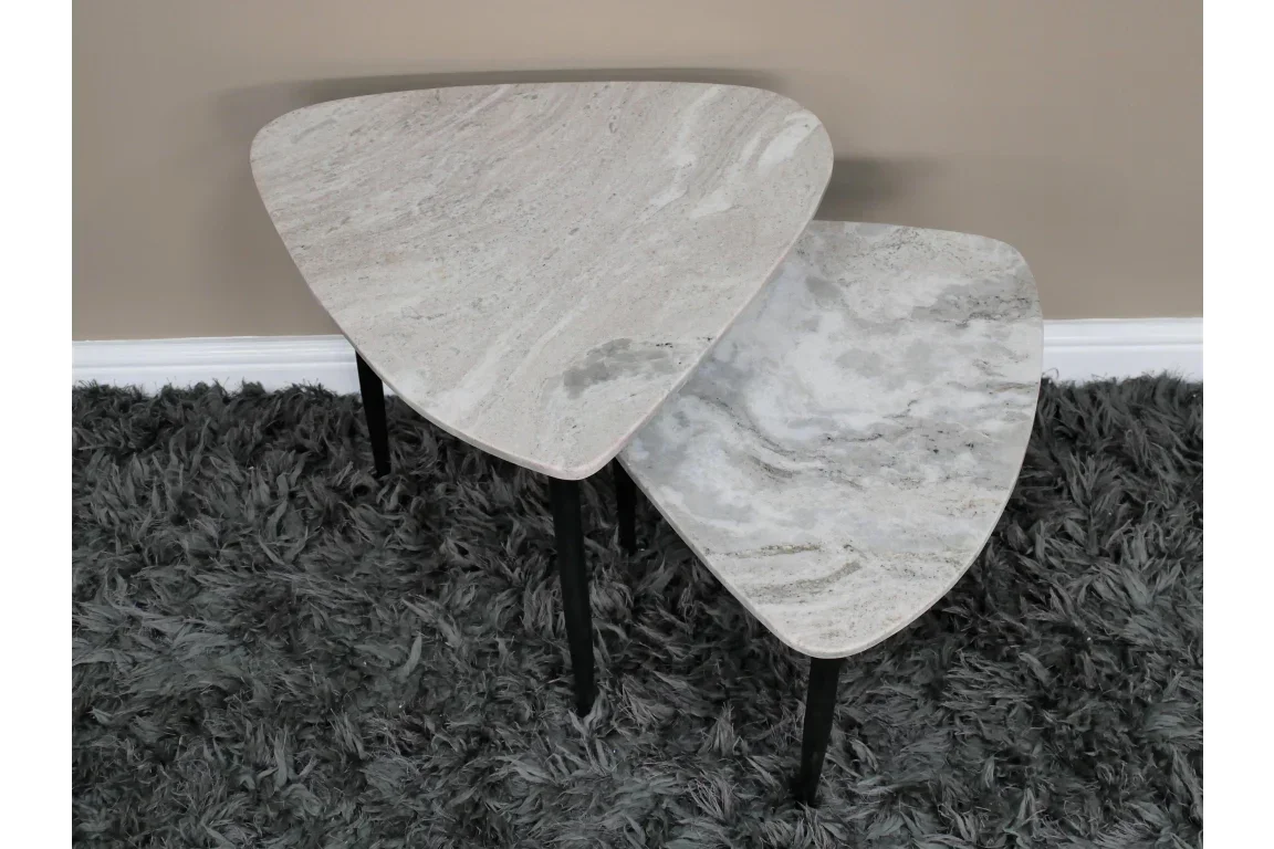 Set of two marble effect nesting tables with black legs on grey shaggy rug
