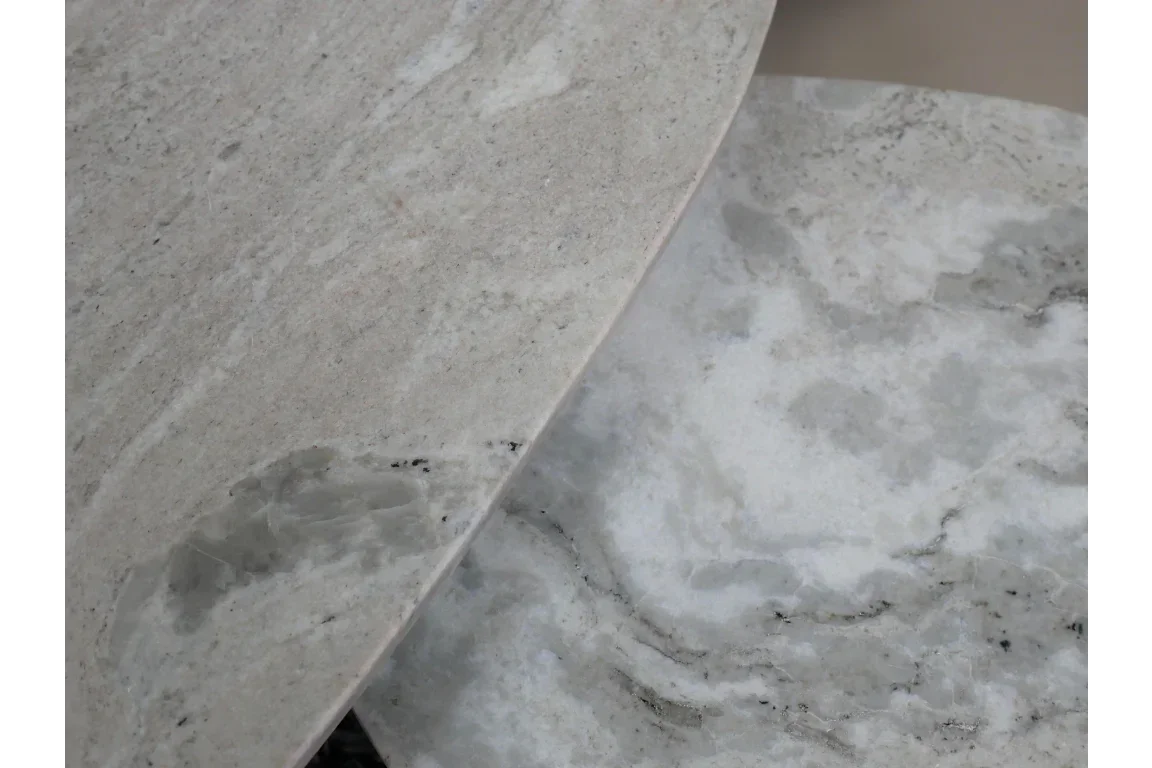 close up of two marble table tops with beige and grey veining
