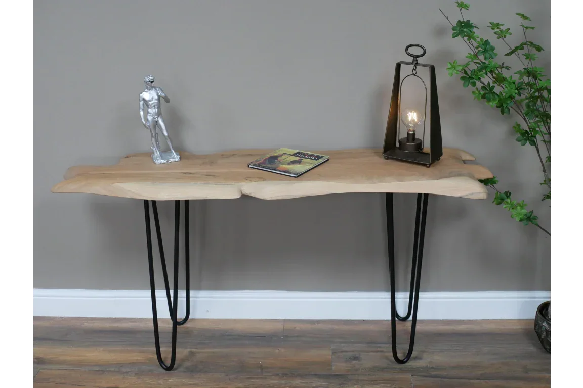 Live edge wooden console table with black metal hairpin legs and minimal decor