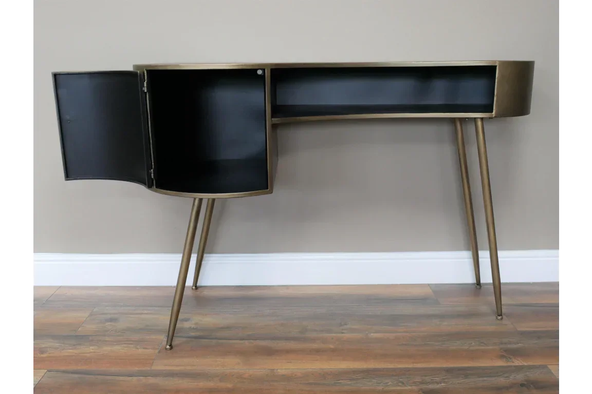 Gold metal console table with black storage compartment and open cabinet door