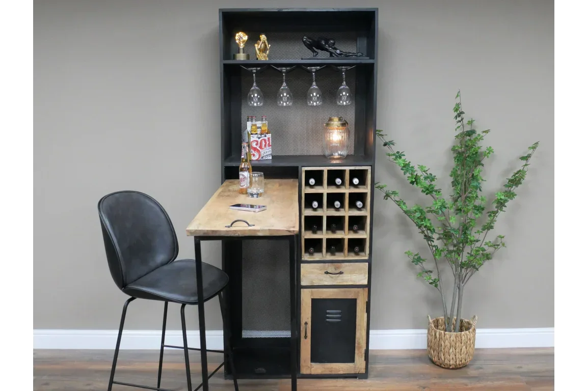 industrial home bar with wooden table, black stool, wine rack, shelves, and glasses