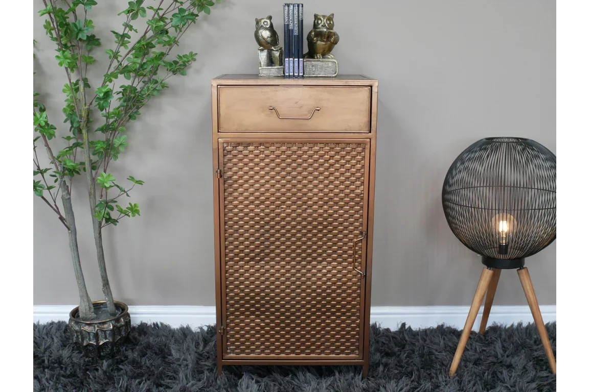 Bronze metal storage cabinet with woven pattern front, positioned on a textured rug