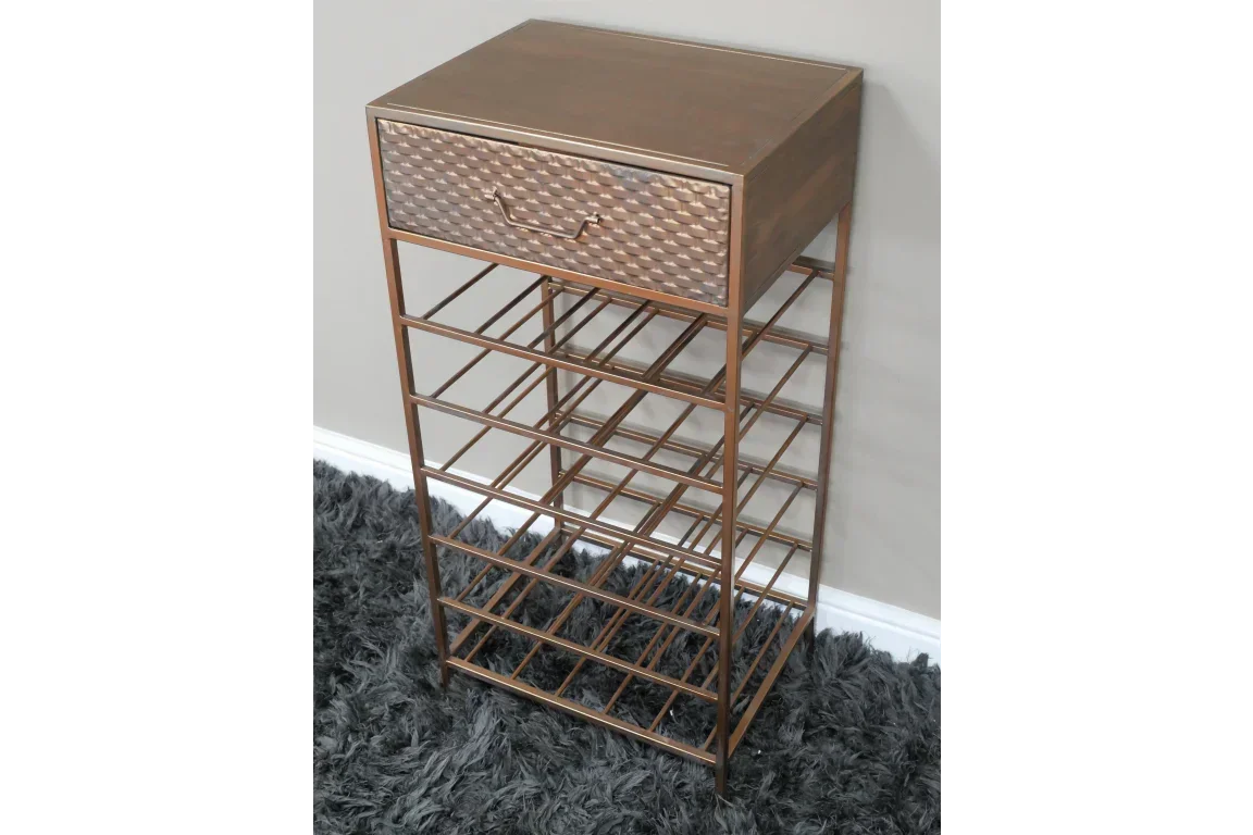 Copper metal wine rack with drawer and geometric front on grey carpet