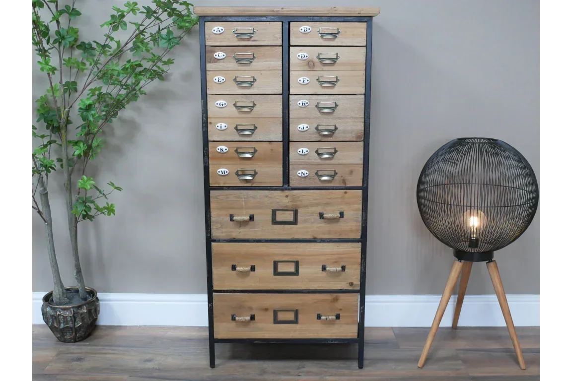 Industrial wood and metal chest of drawers with vintage handles in modern living room setting