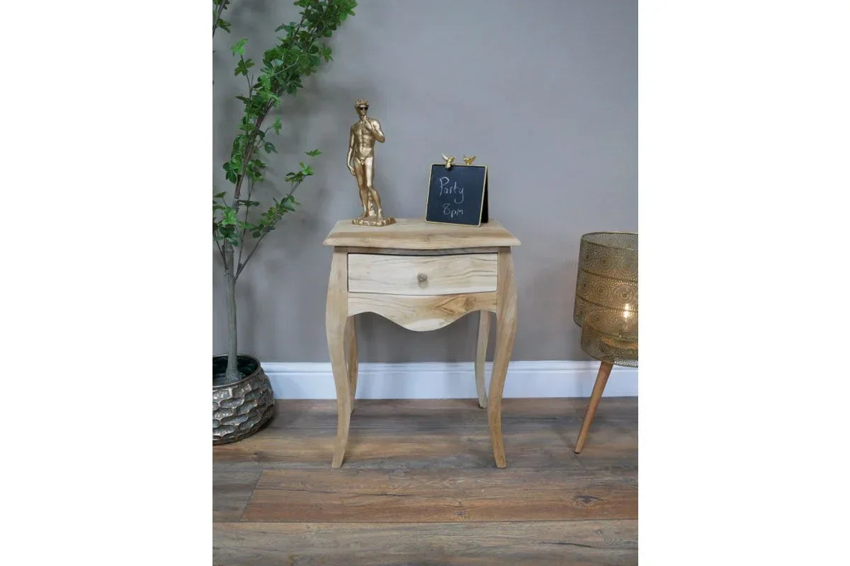 Light wood bedside table with single drawer, styled with ornaments in modern room