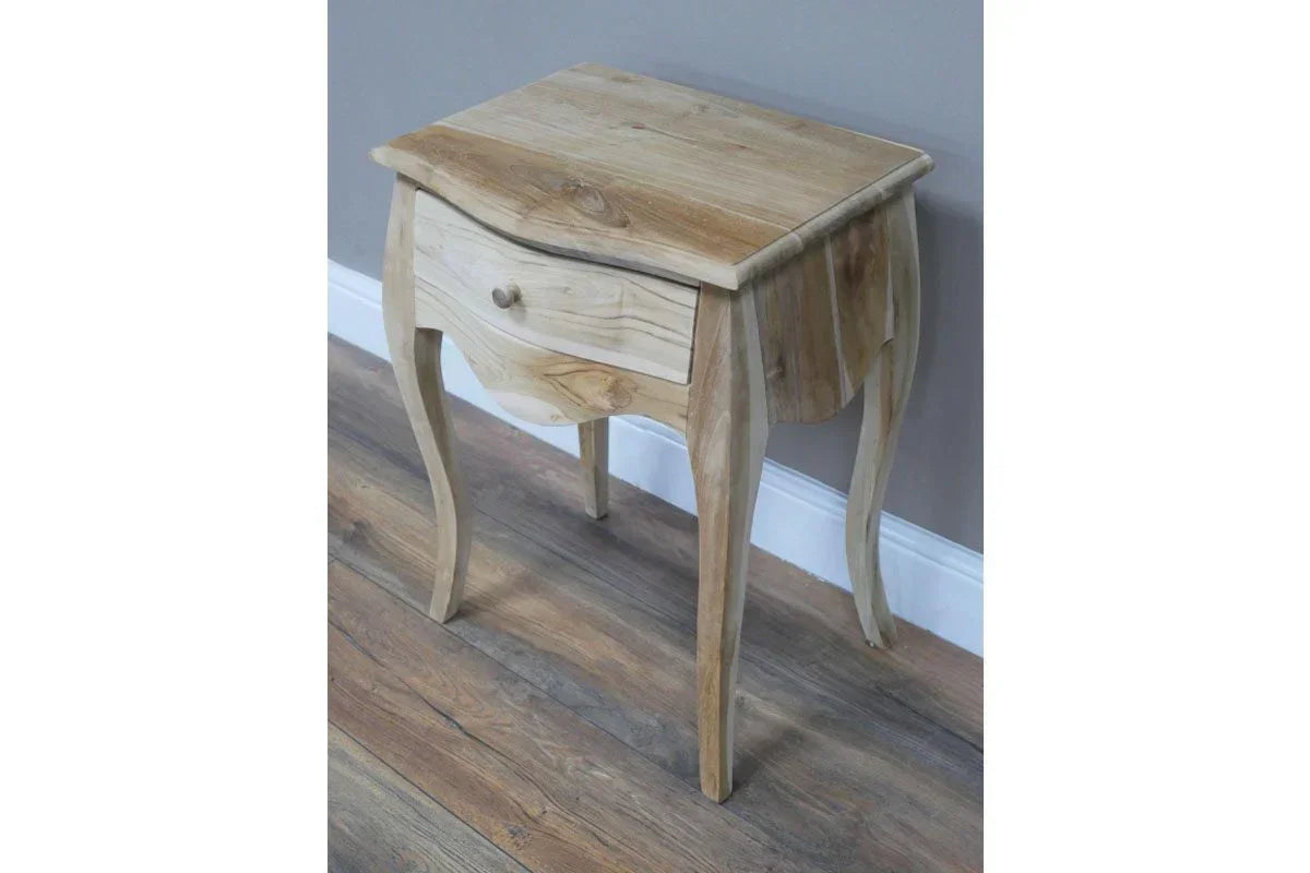 Solid wood bedside table with single drawer and curved legs on a wooden floor