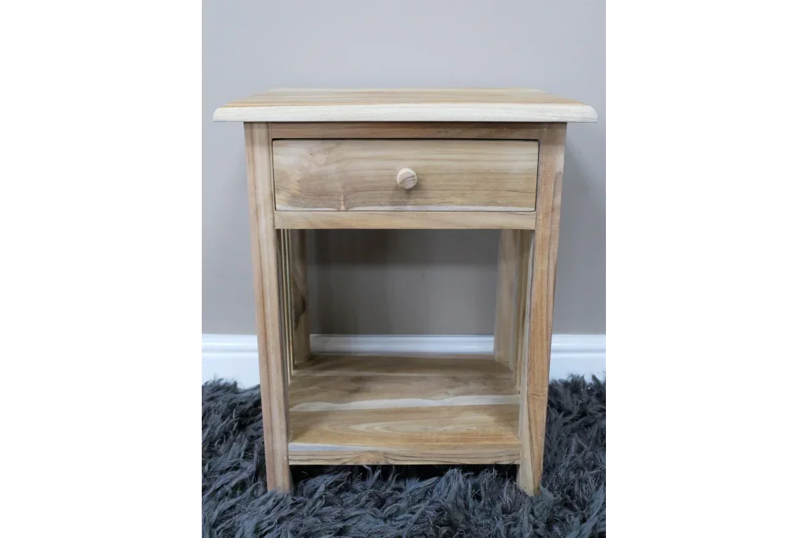 Natural wood bedside table with single drawer and open shelf on grey rug